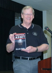 Bill Sewell shows us his novel. Note - no cloak, nor dagger.