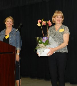 Outgoing President, Judy Brunetti, accepts gifts from board member Cindy Constantino on behalf of her grateful RHA Board.